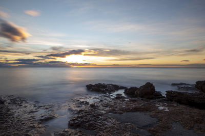 Scenic view of sea against sky during sunset