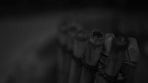 Close-up of metal railing on wood