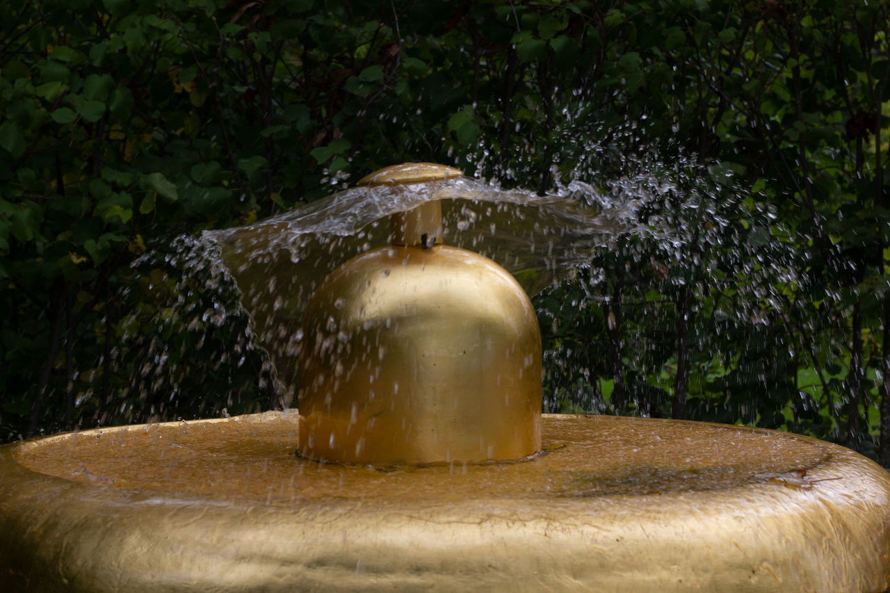 CLOSE-UP OF WATER FOUNTAIN