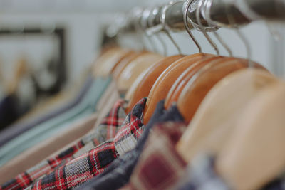 Close-up of clothes hanging on rack at shop