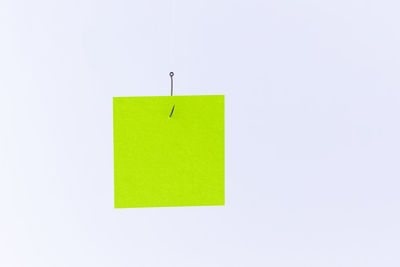 Close-up of green paper against white background