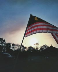 Low angle view of flag against sky