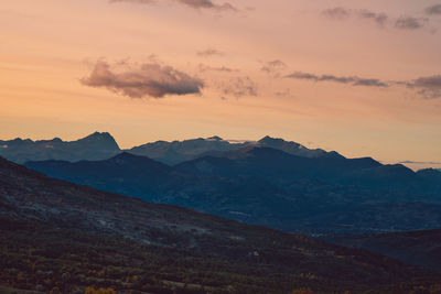 Scenic view of mountains against sky during sunset