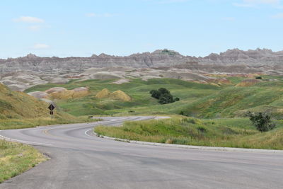 Road amidst landscape against sky