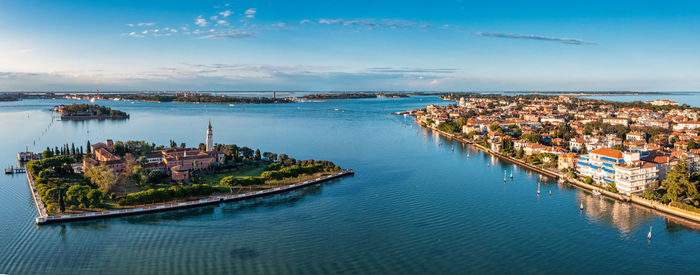 Flying over small venice islands in venetian lagoon.