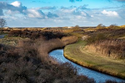 Scenic view of river against sky