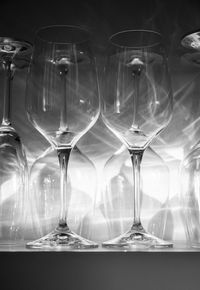 Close-up of wine glasses on table