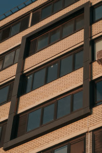 Sand-colored brick loggia on a skyscraper - real estate and modern architecture