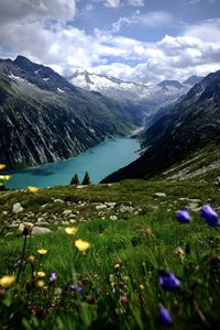 Scenic view of sea and mountains against sky