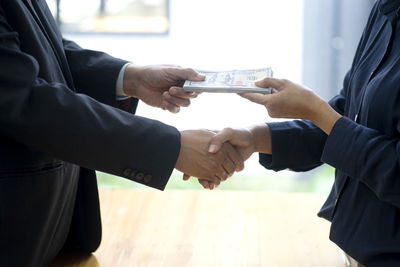 Low angle view of people holding hands