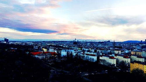 High angle shot of townscape against sky at sunset