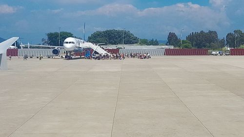 View of people against cloudy sky
