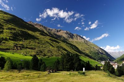 Scenic view of golf course against sky