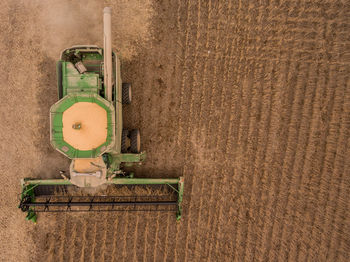 High angle view of combine harvester on field