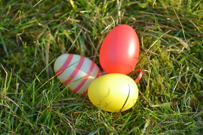 Close-up of red balloon on grass