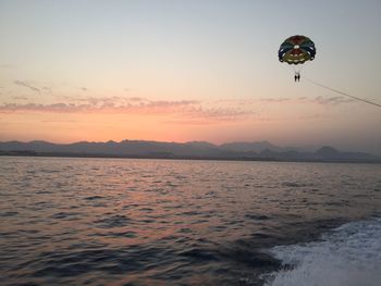 Scenic view of hot air balloon over sea