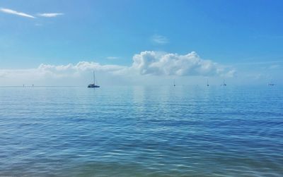 Scenic view of sea against cloudy sky