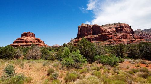 Rock formations on landscape against sky