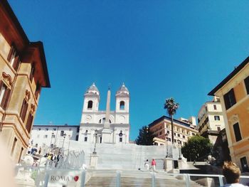 Low angle view of church against blue sky