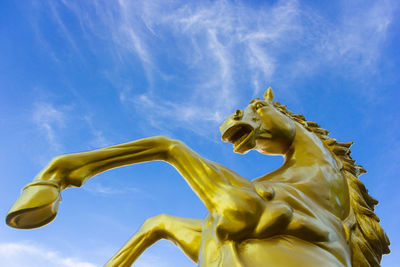 Low angle view of statue against sky