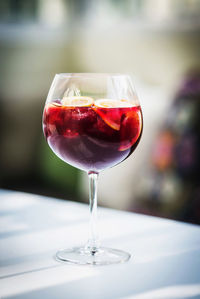 Close-up of wineglass on table