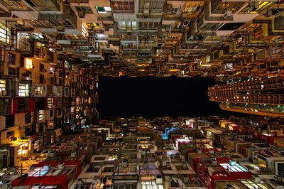 Aerial view of illuminated buildings in city at night