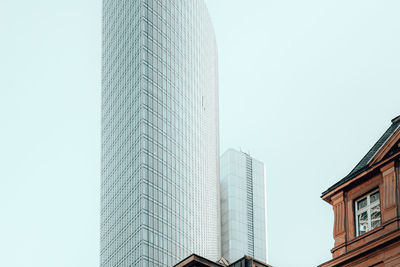 Low angle view of modern buildings against clear sky