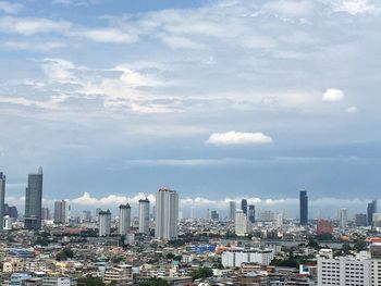 Modern buildings in city against sky