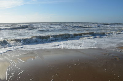 Scenic view of beach against sky