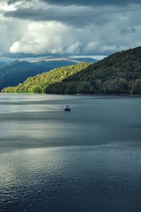 Boat sailing on sea against sky