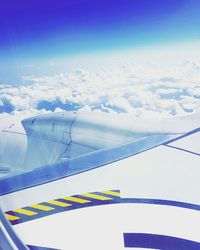 Cropped image of airplane flying over mountain