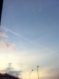 Low angle view of vapor trails in sky