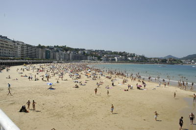 Mid distance shot of people on beach