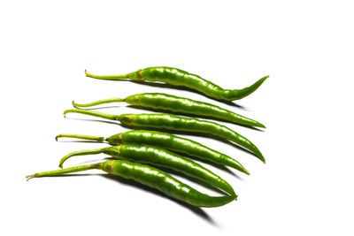 Close-up of green pepper against white background