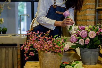 Midsection of florist working in shop