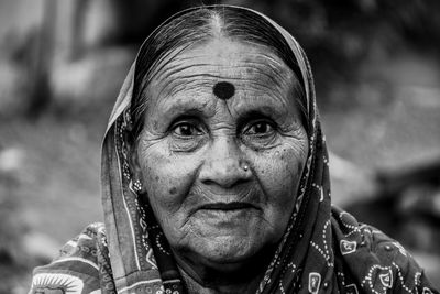 Close-up portrait of senior woman wearing sari