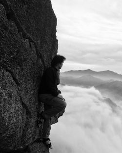 Scenic view of mountains against cloudy sky