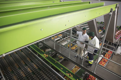 Workers talking in apple factory