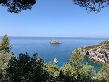 Scenic view of sea against clear blue sky