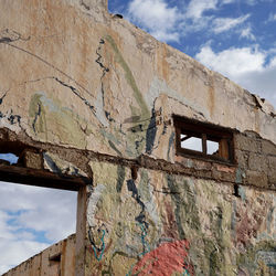 Low angle view of old building against sky