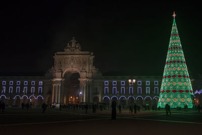 Commerce square at night in lisbon with christmas tree