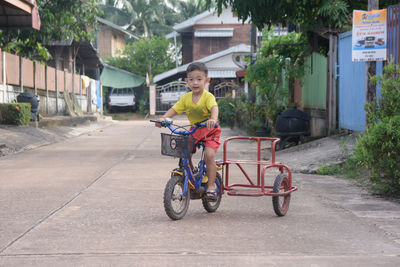 Portrait of boy riding motorcycle