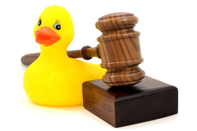 Close-up of yellow toy against white background
