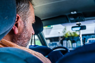 Portrait of man in car