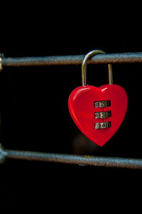 Close-up of love padlocks hanging on railing