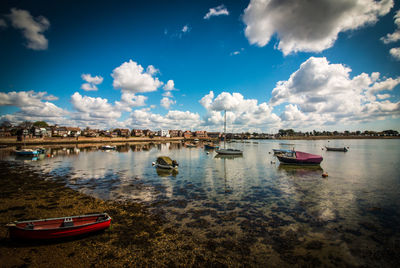 Sailboats sailing in sea against sky