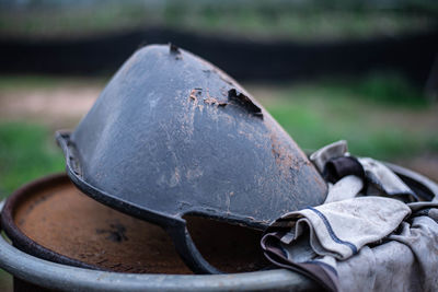 Close-up of rusty metal chain on field