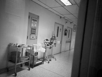 Empty chairs and table in building