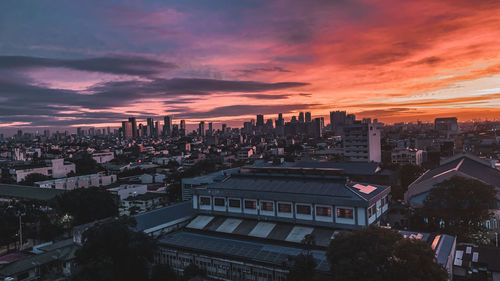 High angle view of buildings against sky during sunset