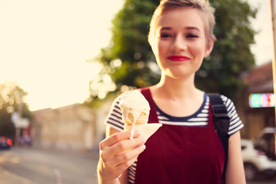 Portrait of woman holding ice cream